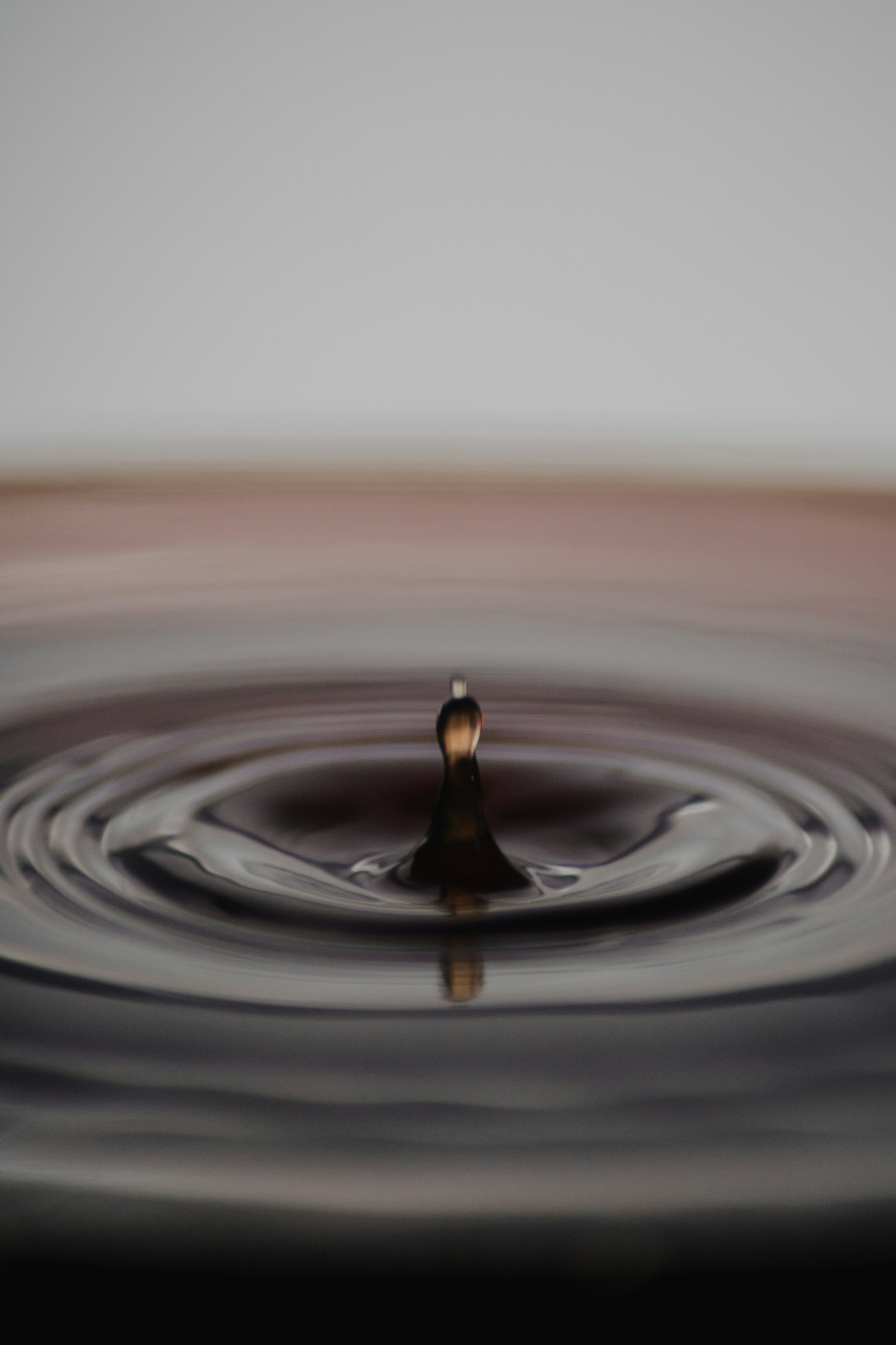 A momentary drop of water creating ripples